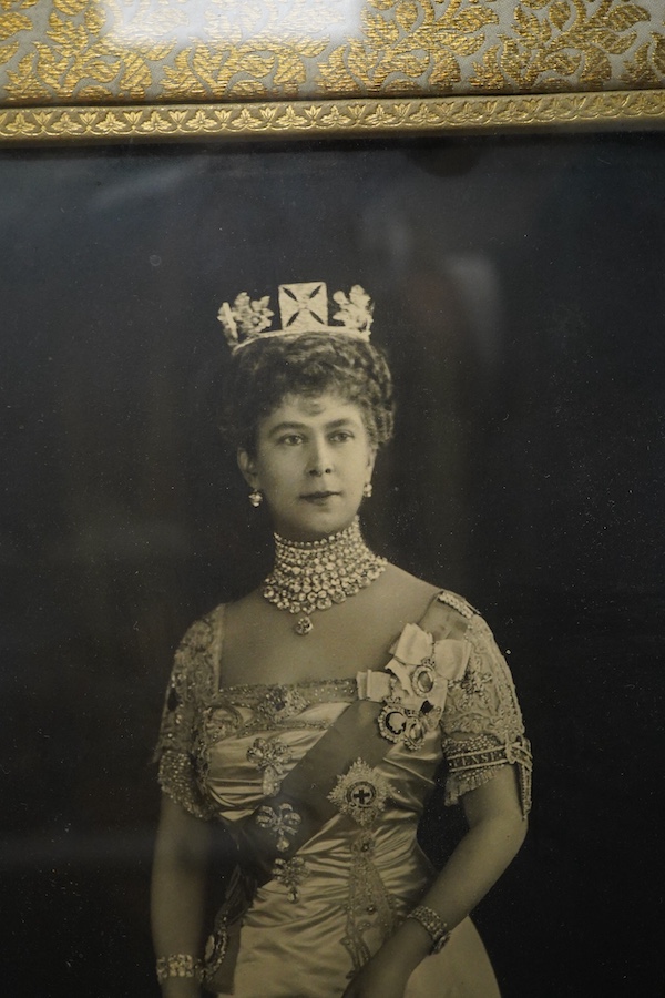 A framed photograph of Queen Mary, signed by the Queen across the bottom of the image and dated 1917, contained within a gilt padded mount and leather frame, overall dimensions 44 x 33cm
